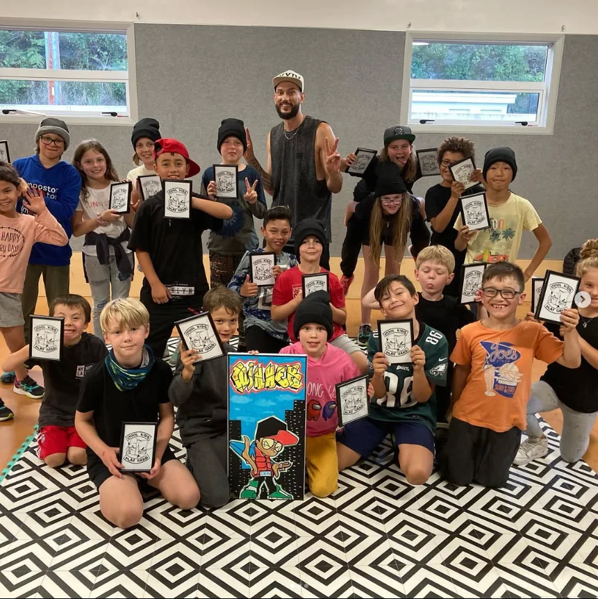 Breaking Limits class posing together with their drawings